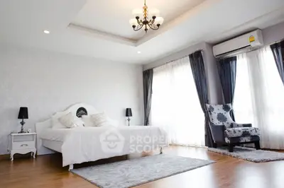 Luxurious bedroom with elegant decor and natural light