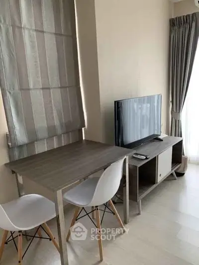 Modern living room with sleek furniture and natural light, perfect for cozy living.