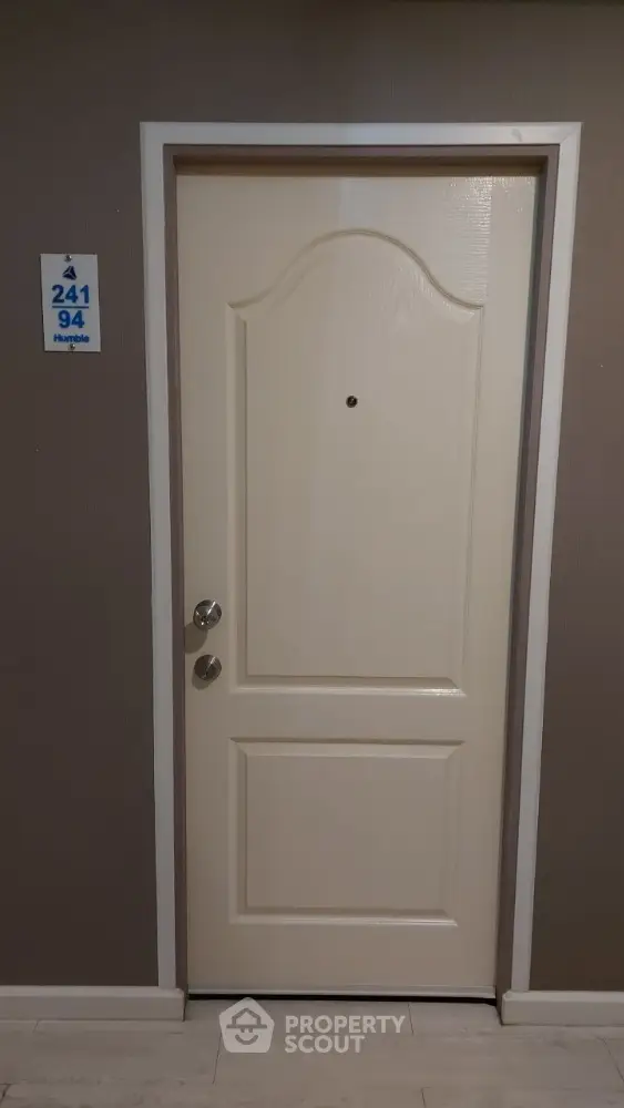 Elegant apartment entrance door with modern design and neutral tones