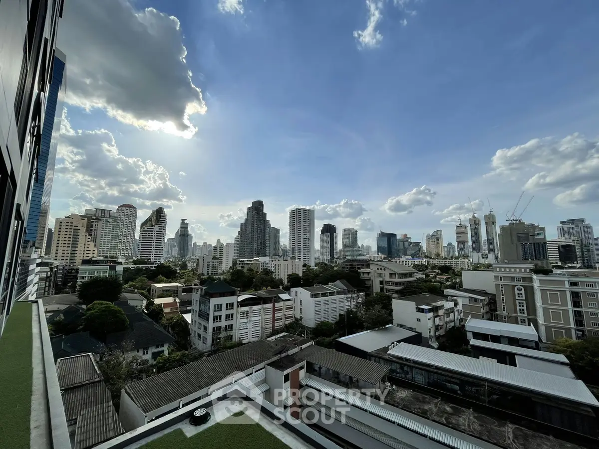 Stunning cityscape view from a high-rise building showcasing urban skyline and vibrant architecture.