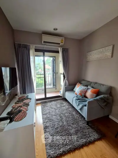 Cozy living room with balcony access and modern decor