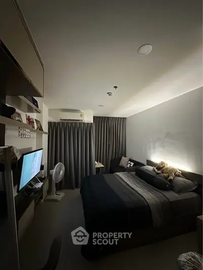 Cozy modern bedroom with stylish decor and ambient lighting, perfect for relaxation and comfort.