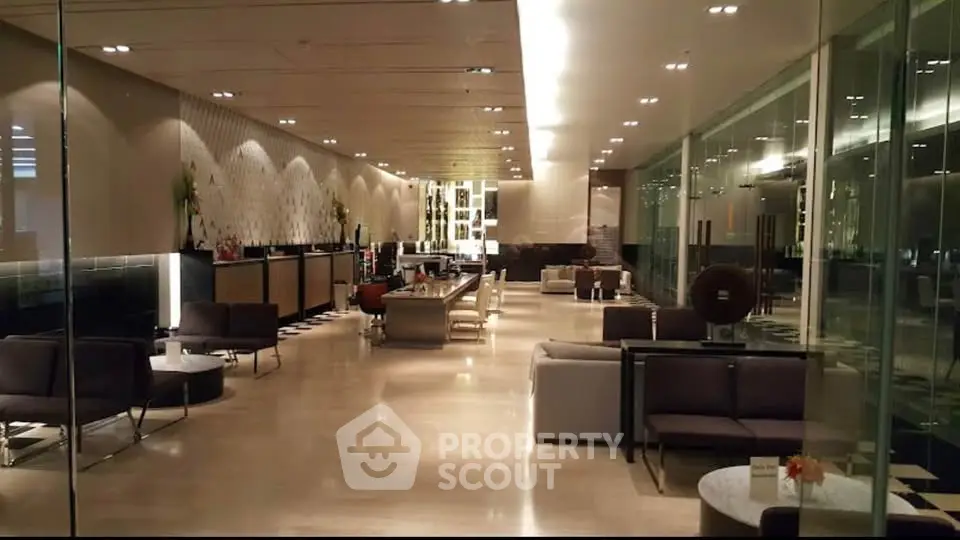 Luxurious modern lobby with elegant seating and ambient lighting in a high-end building.