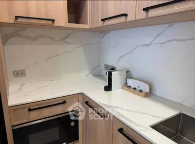 Modern kitchen with sleek marble countertops and built-in appliances