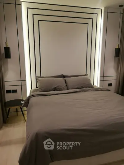 Luxurious modern bedroom with elegant lighting and stylish decor