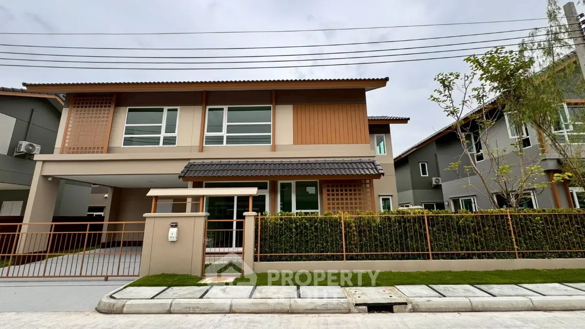 Modern two-story house with landscaped front yard and driveway