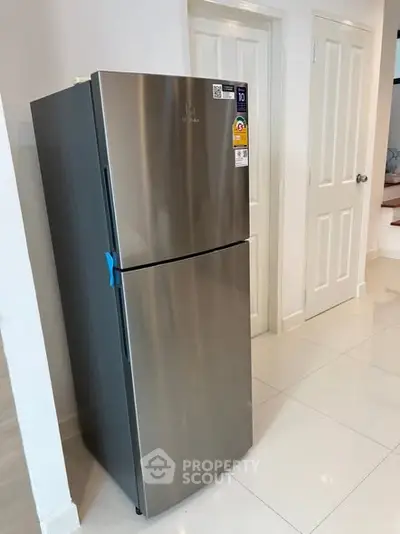 Modern stainless steel refrigerator in sleek kitchen setting
