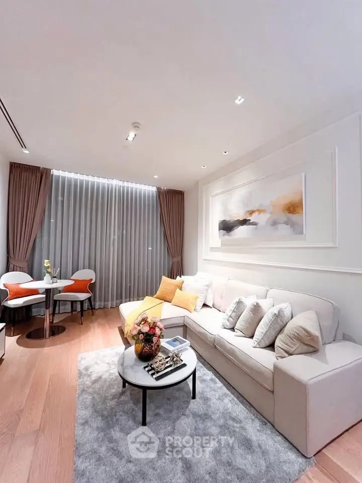 Modern living room with elegant decor, cozy seating, and stylish artwork, perfect for relaxation and entertaining.