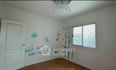 Charming bedroom with artistic wall decor and natural light