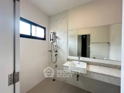 Modern bathroom with sleek design and large mirror