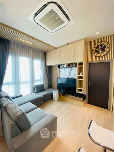 Modern living room with stylish decor and large windows