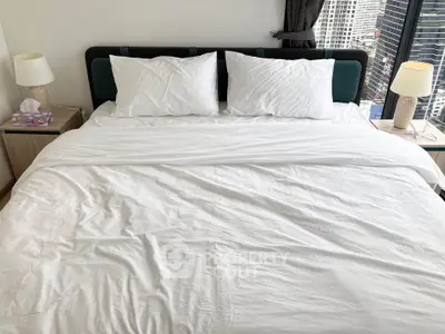 Luxurious bedroom with city view, featuring a plush bed and modern decor, perfect for urban living.
