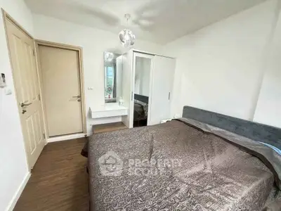 Modern bedroom with stylish decor and ample natural light