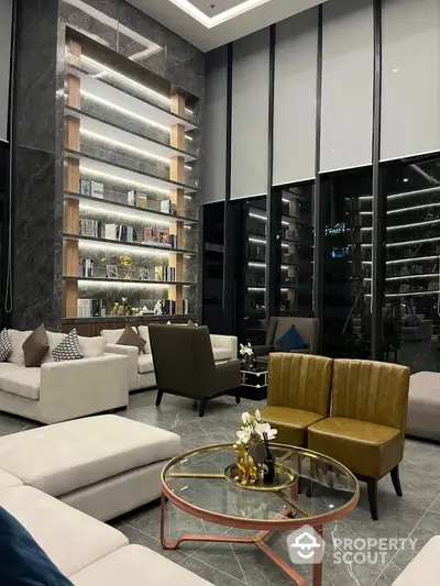 Luxurious high-ceiling living room with elegant marble walls, modern furniture, and a towering bookshelf, perfect for sophisticated living.