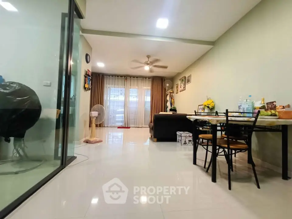 Spacious living room with dining area and modern decor