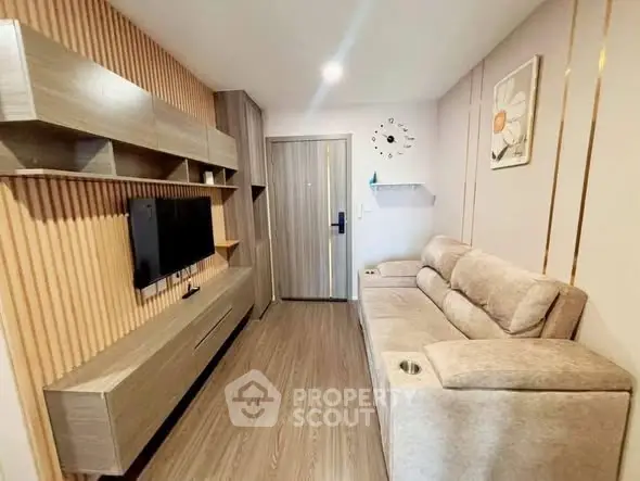 Modern living room with sleek wooden furniture and cozy sofa