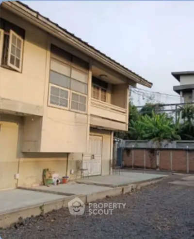 Charming two-story house with spacious outdoor area and modern design.