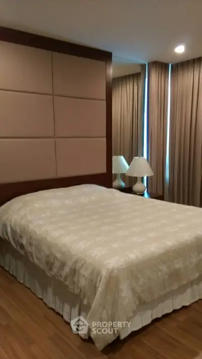 Elegant bedroom with cozy lighting and stylish decor, perfect for relaxation and comfort.