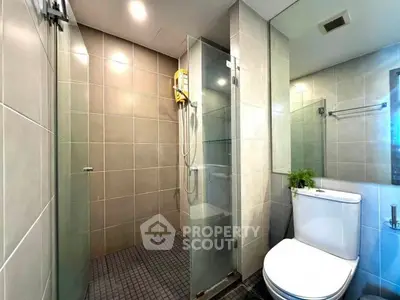 Modern bathroom with glass shower and sleek tile design