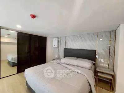 Luxurious bedroom with modern design and elegant furnishings in a high-end property.