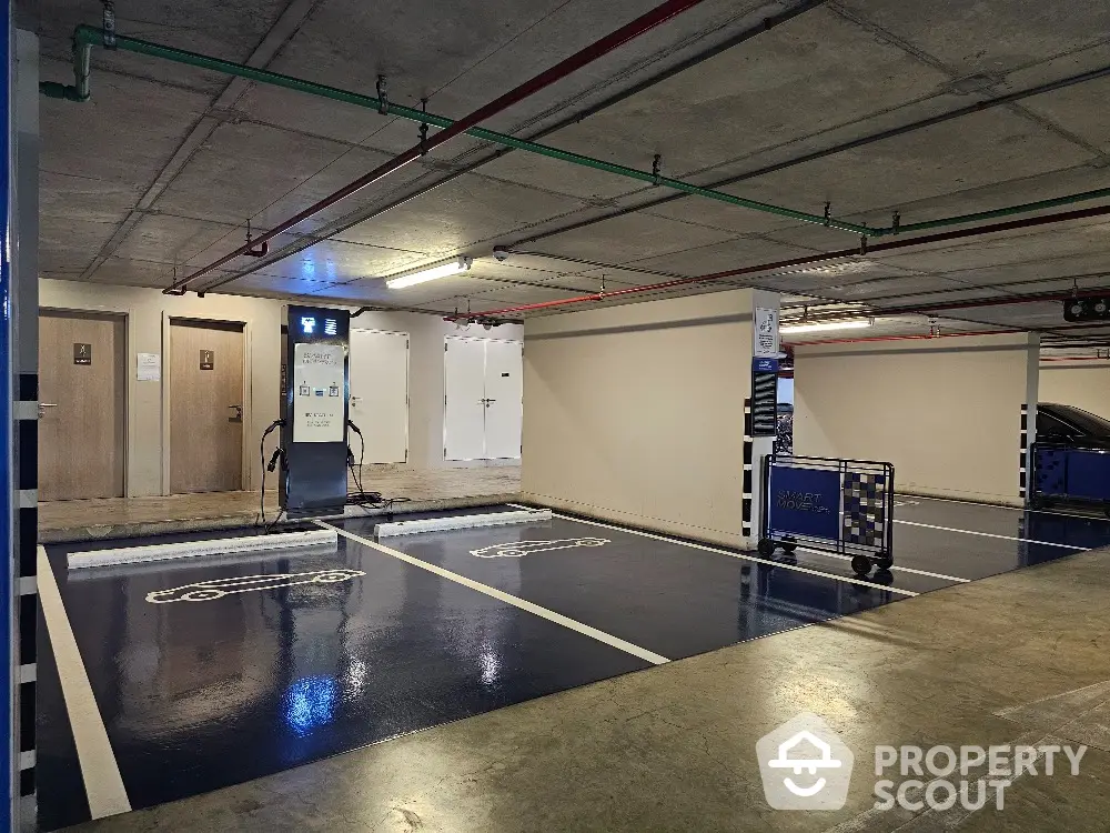 Modern parking garage with electric vehicle charging stations and sleek design.