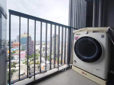 High-rise balcony with city view and modern washing machine, perfect for urban living.