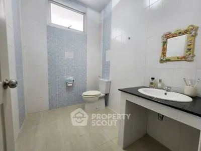 Spacious bathroom with modern fixtures and elegant tile design