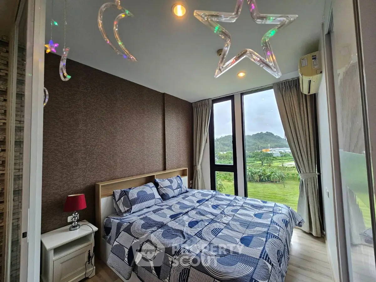 Charming bedroom with scenic view and modern decor in a stylish apartment
