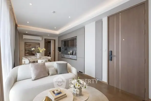 Elegant modern living room with stylish decor and open layout, featuring a cozy seating area and dining space.