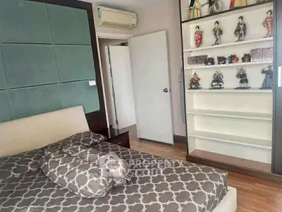 Cozy bedroom with stylish decor and unique display shelves