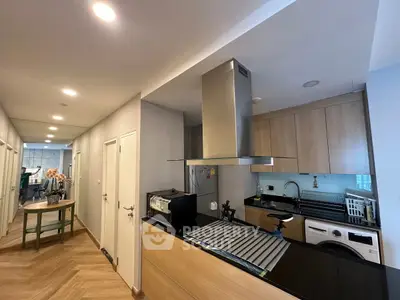 Modern kitchen with sleek appliances and open layout in a stylish apartment