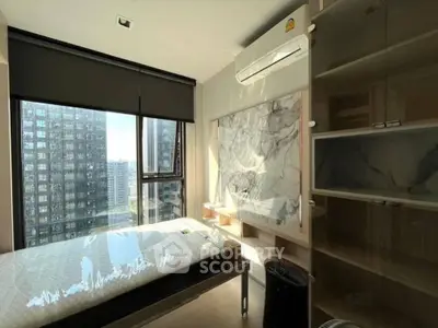 Modern bedroom with large window and city view, featuring sleek design and ample natural light.