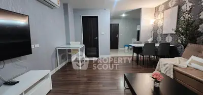 Modern living room with stylish decor and open layout, featuring hardwood floors and contemporary furniture.