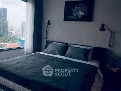 Modern bedroom with city view, featuring a cozy bed and stylish decor, perfect for urban living.