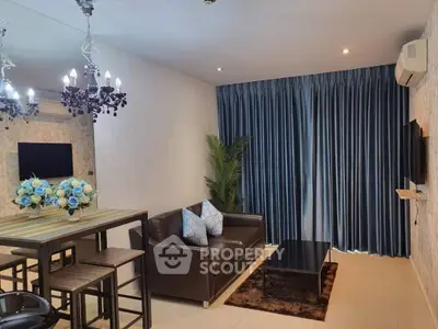 Stylish living room with elegant decor, featuring a leather sofa, chic chandelier, and floor-to-ceiling curtains.