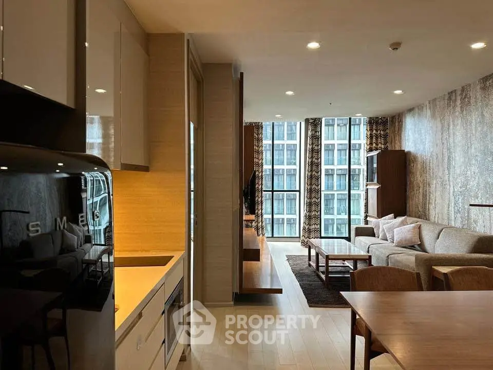Modern living room with stylish furniture and large windows offering city views