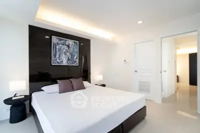 Modern bedroom with sleek design and stylish decor in a contemporary apartment.