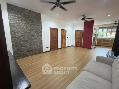 Spacious living room with modern design and open kitchen layout