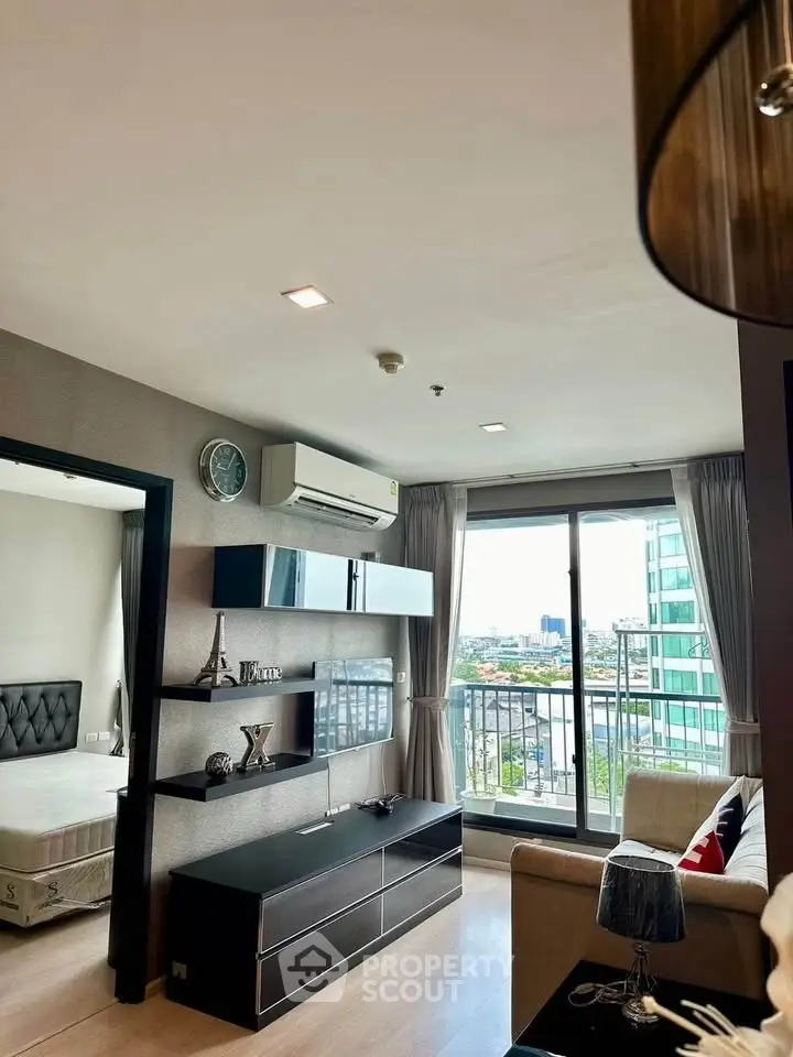 Modern living room with balcony view in high-rise apartment