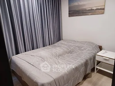 Cozy bedroom with modern decor and elegant curtains