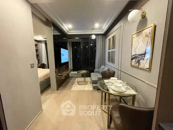 Modern living room with elegant decor and open layout, featuring a cozy seating area and stylish dining space.