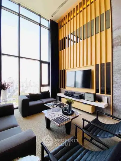 Luxurious high-ceiling living room with modern decor and stunning city view.