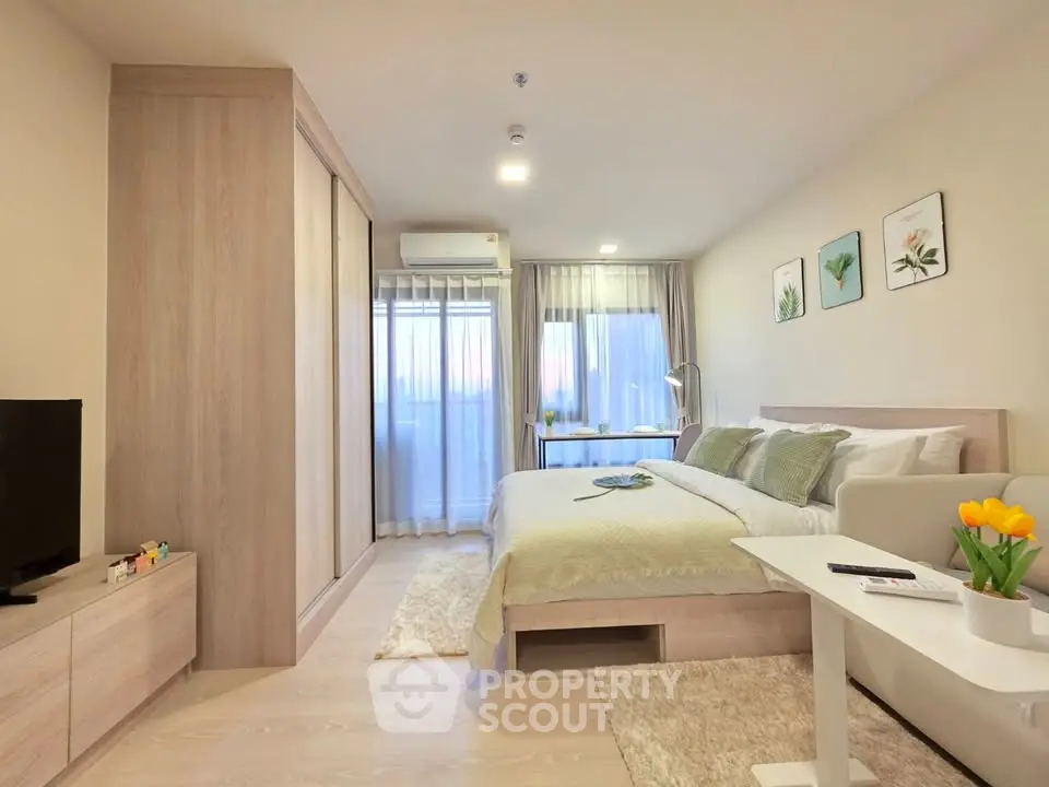 Modern bedroom with cozy decor and natural light, featuring a stylish bed and elegant furnishings.