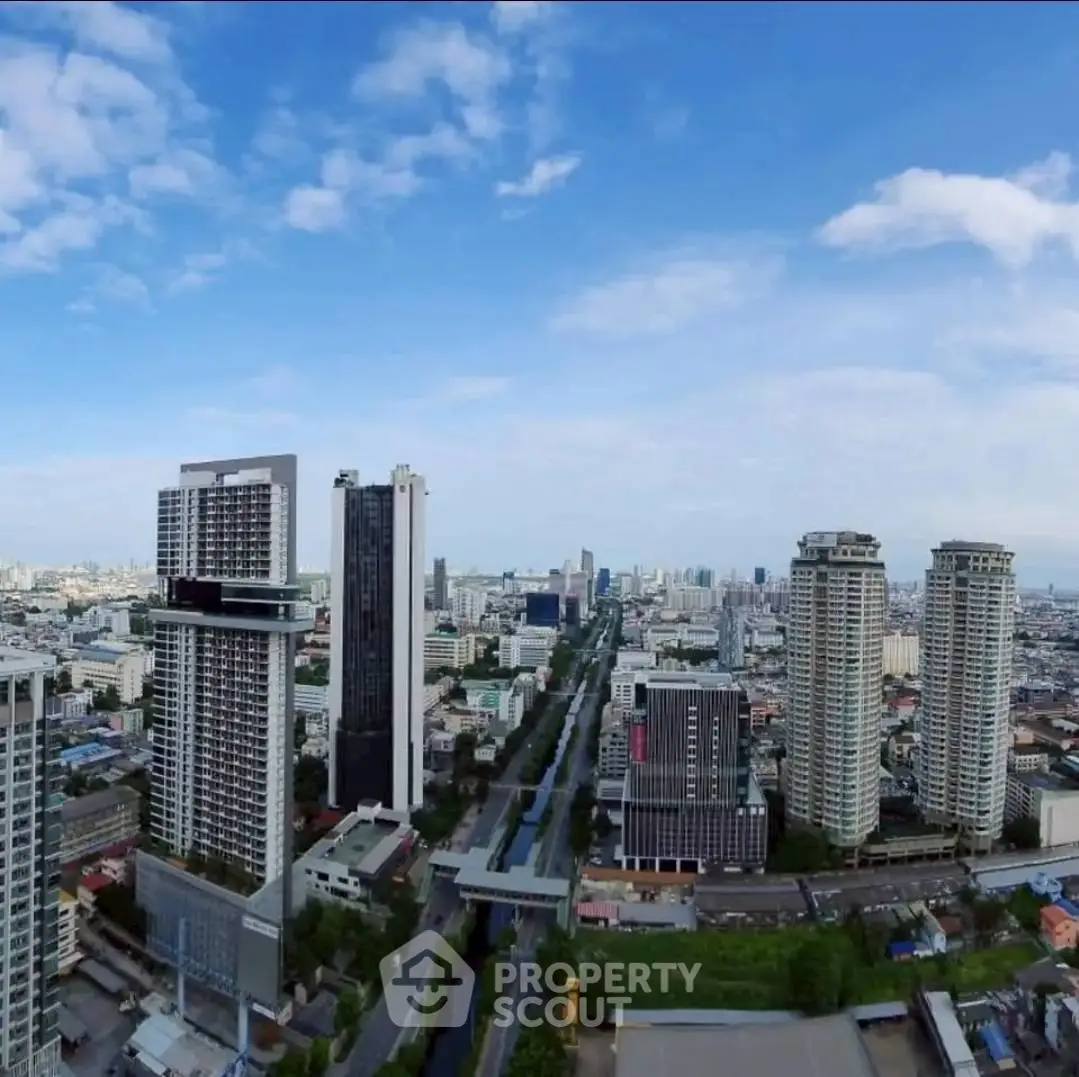 Stunning cityscape view with modern high-rise buildings under a clear blue sky.