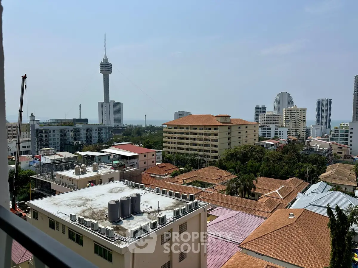 Stunning cityscape view with diverse architecture and iconic tower, perfect for urban living enthusiasts.