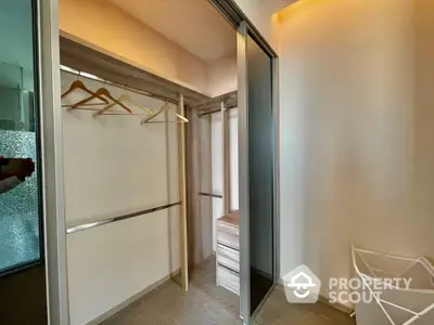 Spacious walk-in closet with modern design and ample storage space