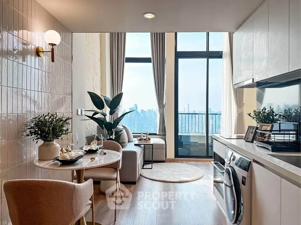 Modern open-plan living room with city view and balcony access, featuring stylish decor and integrated appliances.