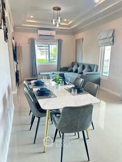 Modern living room with elegant dining area and stylish decor