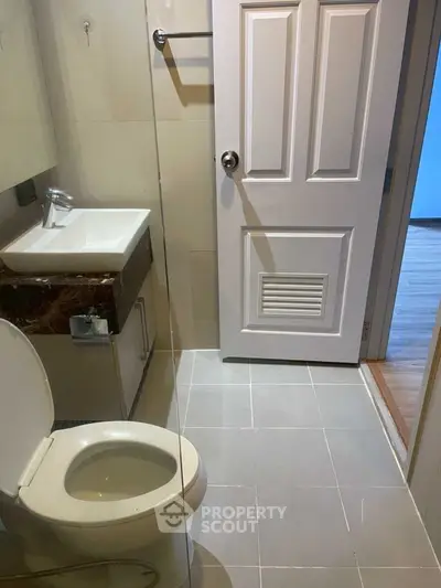 Modern bathroom with sleek fixtures and glass shower enclosure