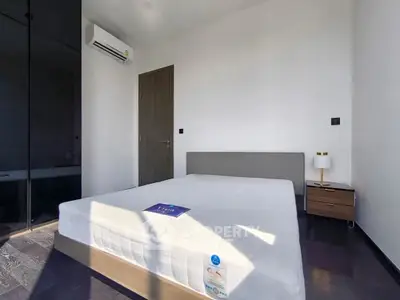 Modern bedroom with sleek design, featuring a comfortable bed and stylish decor.